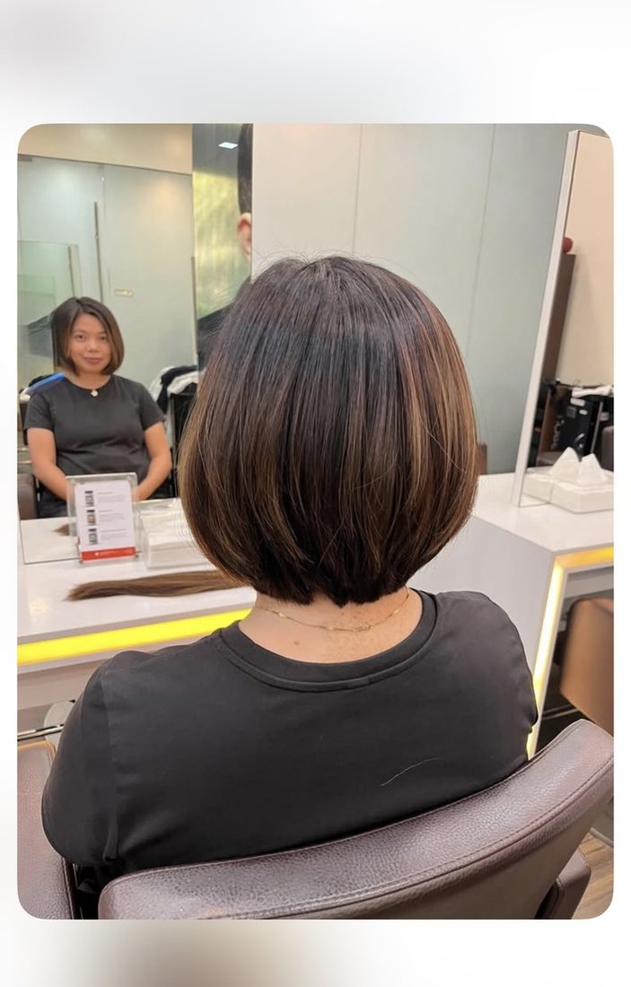 After the donation: a fresh bob — the ponytail ready for the factory