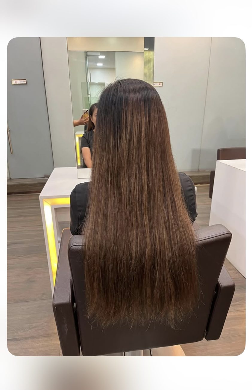 Years of growth in the salon chair, moments before the donation cut
